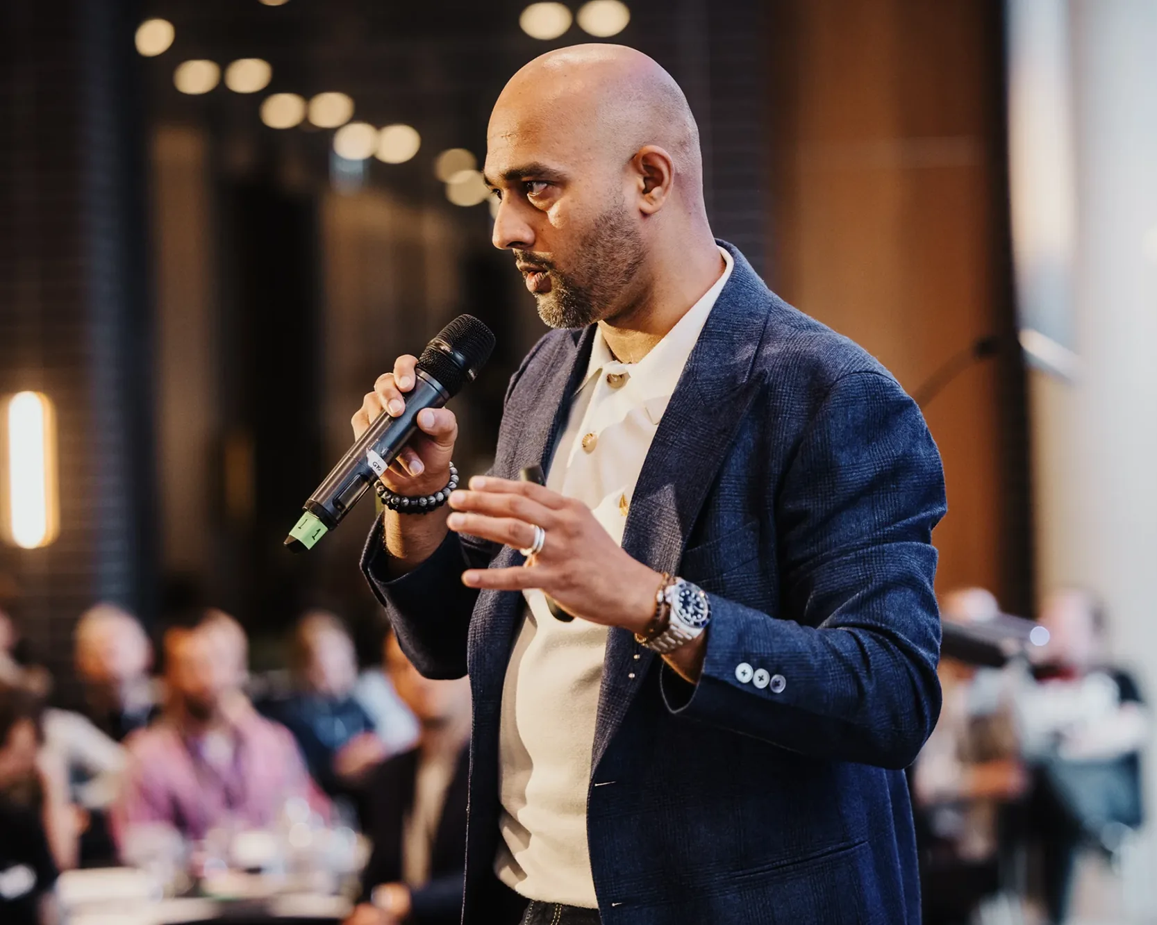 Abi Iyer speaking at an event